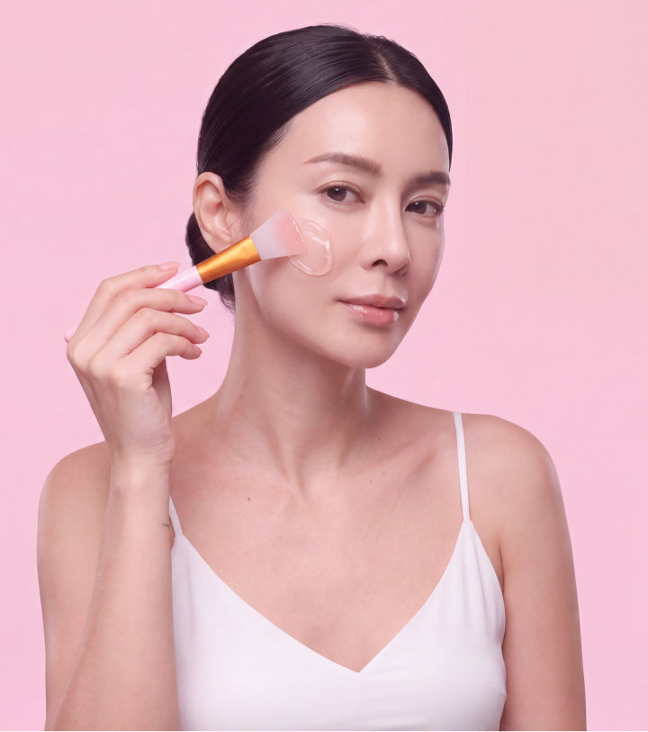 Woman applying Quia overnight mask